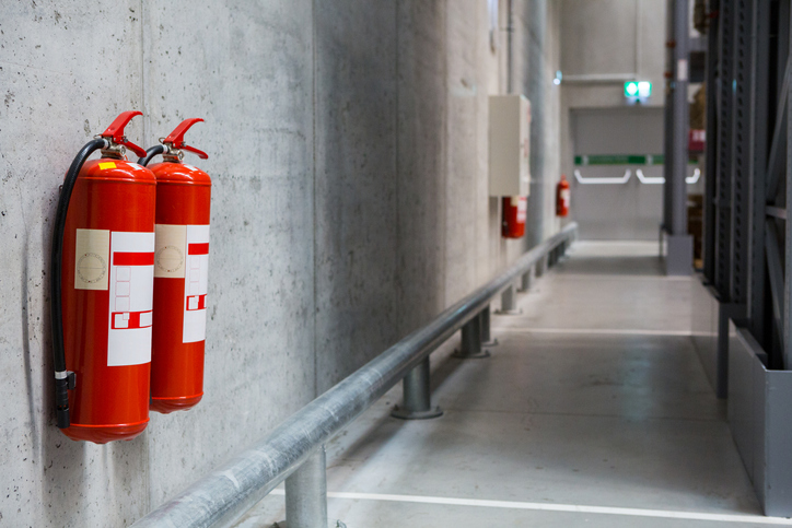 Fire extinguishers and proper flue spacing between pallet racking contribute to warehouse safety